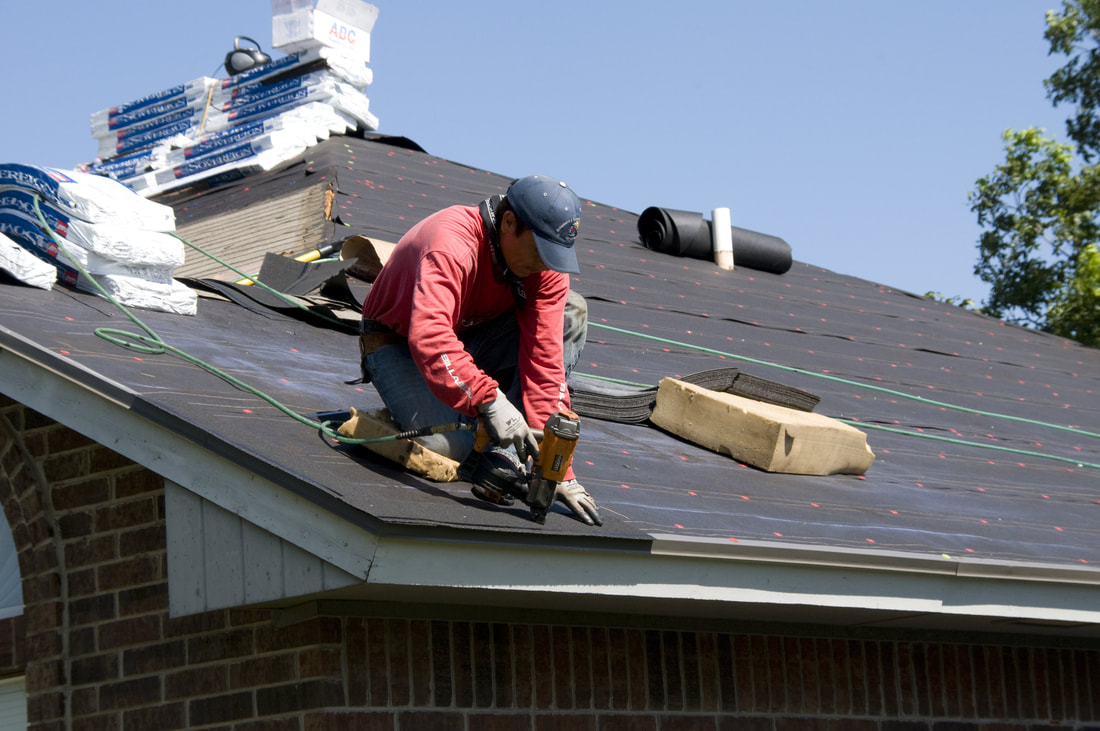 Guy fixing roof
